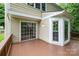 View of the wood deck with sliding glass door and windows at 7114 Kinsmore Ln, Charlotte, NC 28269
