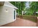 View of the wood deck with wood railings and the rear side of the house at 7114 Kinsmore Ln, Charlotte, NC 28269