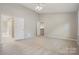 Spacious bedroom with carpet, a ceiling fan and doorways leading to other rooms at 7114 Kinsmore Ln, Charlotte, NC 28269