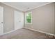 Bedroom featuring a closet and a window, providing ample storage and natural light at 7114 Kinsmore Ln, Charlotte, NC 28269