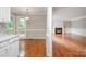 Inviting living room featuring a fireplace, wood floors, and natural light at 7114 Kinsmore Ln, Charlotte, NC 28269