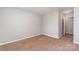 Neutral bedroom with carpet, freshly painted, with access to another room or closet at 7121 Bidford Ct, Indian Land, SC 29707