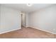 Clean bedroom with neutral carpet, light gray walls, and a closet for storage at 7121 Bidford Ct, Indian Land, SC 29707