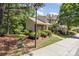This home has a beautifully landscaped yard with healthy green lawn, mature trees, and a well maintained sidewalk at 7121 Bidford Ct, Indian Land, SC 29707