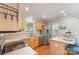 Efficient kitchen features stainless steel appliances, light wood cabinetry, and adjacent bar stool seating at 7121 Bidford Ct, Indian Land, SC 29707