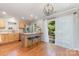 Inviting kitchen with wooden cabinets, stainless steel appliances, and a patio door at 7121 Bidford Ct, Indian Land, SC 29707