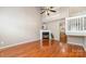 Spacious living room with hardwood floors, a fireplace with white mantle, and plenty of natural light at 7121 Bidford Ct, Indian Land, SC 29707