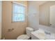 Bathroom with white toilet, vanity with sink, and a mirror at 7320 Ritter Dr, Charlotte, NC 28270