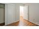 Bedroom featuring wood floors, closet and a doorway at 7320 Ritter Dr, Charlotte, NC 28270