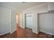 Bedroom with an open closet and wood floors at 7320 Ritter Dr, Charlotte, NC 28270