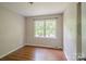 Bedroom with wood floors and a window at 7320 Ritter Dr, Charlotte, NC 28270