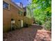 Backyard exterior of brick home featuring a door and window at 7320 Ritter Dr, Charlotte, NC 28270