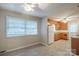 Bright, combined kitchen and dining area with ceiling fans and abundant natural light at 7320 Ritter Dr, Charlotte, NC 28270