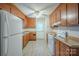 Functional kitchen with ample cabinet space and modern white appliances at 7320 Ritter Dr, Charlotte, NC 28270