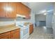 Well-lit kitchen area with neutral countertops and adjacent open space at 7320 Ritter Dr, Charlotte, NC 28270
