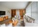 A cozy living room with stylish furnishings, a large window, and a built-in bookcase at 7320 Ritter Dr, Charlotte, NC 28270