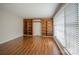 Bright living room with hardwood floors and built-in wooden bookshelves at 7320 Ritter Dr, Charlotte, NC 28270