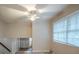 Open landing with a ceiling fan and view of the stairs and a window at 7320 Ritter Dr, Charlotte, NC 28270