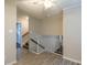 Open landing with a ceiling fan and view of the stairs at 7320 Ritter Dr, Charlotte, NC 28270