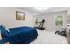 Spacious bedroom area including a treadmill, weights, and natural light at 7798 Sand Trap Ln, Stanley, NC 28164