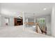Open bonus room with hardwood stairs and a built in entertainment center at 7798 Sand Trap Ln, Stanley, NC 28164