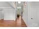 Grand foyer with hardwood floors, a soaring ceiling, and a staircase leading to the upper level at 7798 Sand Trap Ln, Stanley, NC 28164