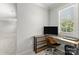 Dedicated office space with desk, chair, and natural lighting at 7798 Sand Trap Ln, Stanley, NC 28164