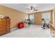 Comfortable home office setup with a desk, chair, and exercise bike at 7798 Sand Trap Ln, Stanley, NC 28164