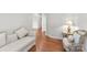 Cozy sitting area with hardwood floors, comfortable seating, and soft lighting at 7798 Sand Trap Ln, Stanley, NC 28164