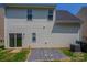 Exterior backyard view with a sliding glass door and gravel area at 8226 Gabon Ct, Charlotte, NC 28215