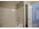 Bright bathroom with a tub-shower combo and linen closet at 8226 Gabon Ct, Charlotte, NC 28215