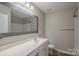 Well-lit bathroom with a large mirror and vanity at 8226 Gabon Ct, Charlotte, NC 28215