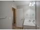 Bathroom featuring a vanity and doorway that leads to the carpeted bedroom at 8226 Gabon Ct, Charlotte, NC 28215