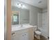 Bathroom view showcasing the vanity, shower, and toilet at 8226 Gabon Ct, Charlotte, NC 28215