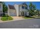 Charming two-story home with attached garage, complemented by a well-maintained lawn at 8226 Gabon Ct, Charlotte, NC 28215