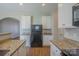Kitchen with granite countertops, stainless appliances, and an open layout at 8226 Gabon Ct, Charlotte, NC 28215