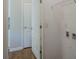 Bright laundry room has vinyl flooring, storage shelf and hookups at 8226 Gabon Ct, Charlotte, NC 28215