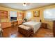 Bedroom with built-in shelves, hardwood floors, and natural light at 100 S Rudisill Ave, Cherryville, NC 28021