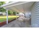 Open carport area with a view of the backyard patio and grassy yard at 100 S Rudisill Ave, Cherryville, NC 28021