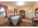 Classic dining room featuring a large table with seating for six, a china cabinet, and warm lighting at 100 S Rudisill Ave, Cherryville, NC 28021