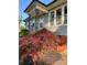 Exterior close-up showcasing the home's architectural details, landscaping, and entrance at 100 S Rudisill Ave, Cherryville, NC 28021