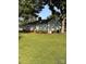 Traditional home with mature trees, green lawn, and a classic architectural style at 100 S Rudisill Ave, Cherryville, NC 28021