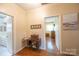 Hallway featuring beautiful trim and doorways to a bathroom and bedroom at 100 S Rudisill Ave, Cherryville, NC 28021