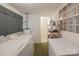 Bright laundry room with appliances and adjacent bathroom for added convenience at 100 S Rudisill Ave, Cherryville, NC 28021