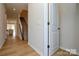 Bright entryway with hardwood floors, a staircase, and a view into the open-concept living space at 1028 Grays Mill Rd, Charlotte, NC 28215