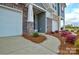Inviting entrance featuring a stone facade, well-manicured landscaping, and a charming entryway at 1028 Grays Mill Rd, Charlotte, NC 28215