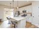 Modern kitchen with white cabinetry, an island with pendant lighting, and stainless steel appliances at 1028 Grays Mill Rd, Charlotte, NC 28215