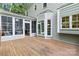 Wooden deck on the back of the home with sunroom at 10927 Thornhill Club Dr, Charlotte, NC 28277
