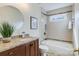 Updated bathroom featuring modern fixtures and granite vanity at 10927 Thornhill Club Dr, Charlotte, NC 28277