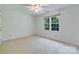Bright bedroom featuring a neutral palette and a large window with backyard view at 10927 Thornhill Club Dr, Charlotte, NC 28277